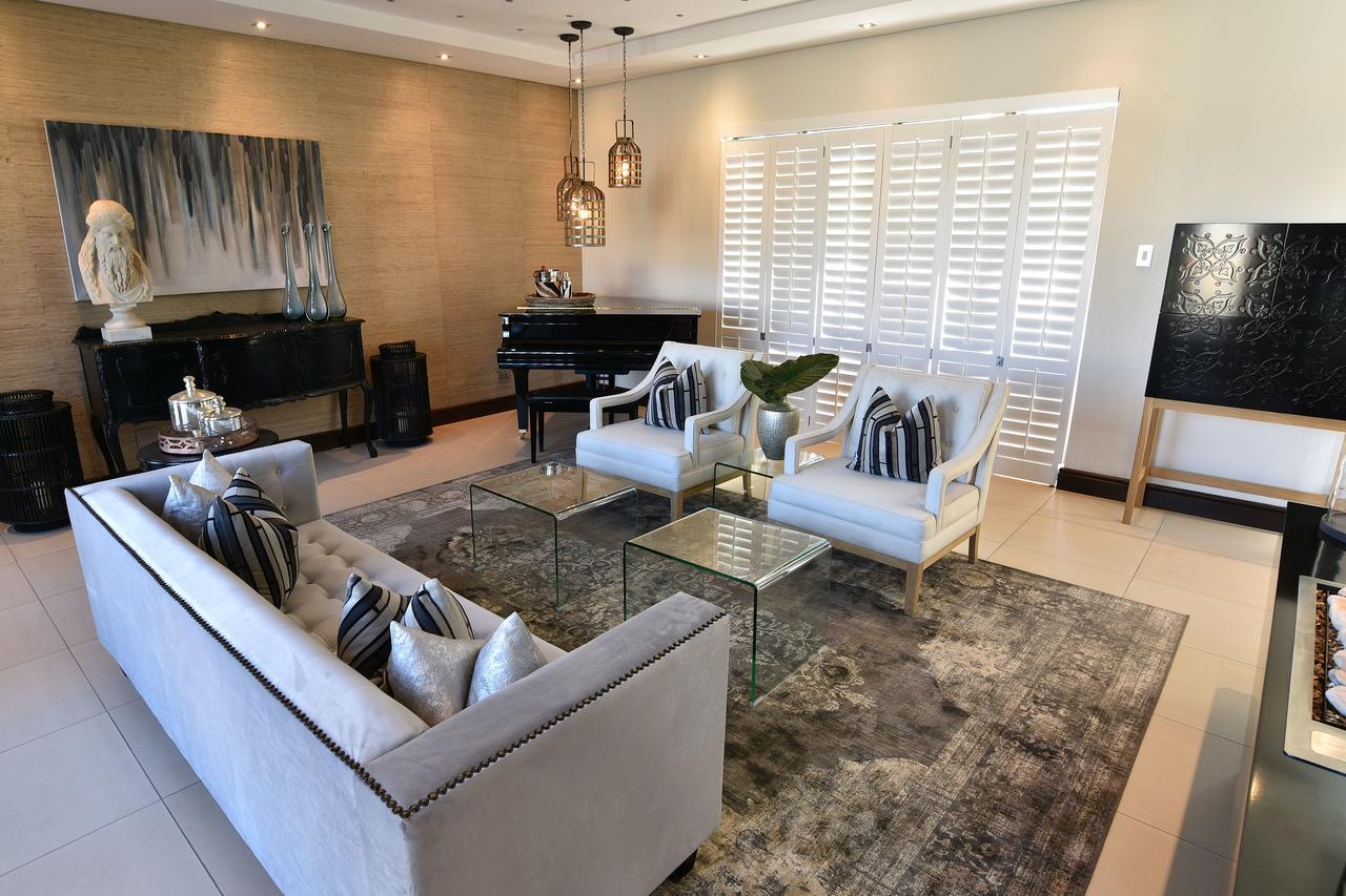 Tredenham Boutique Hotel Bloemfontein Exterior photo A living room with a rug